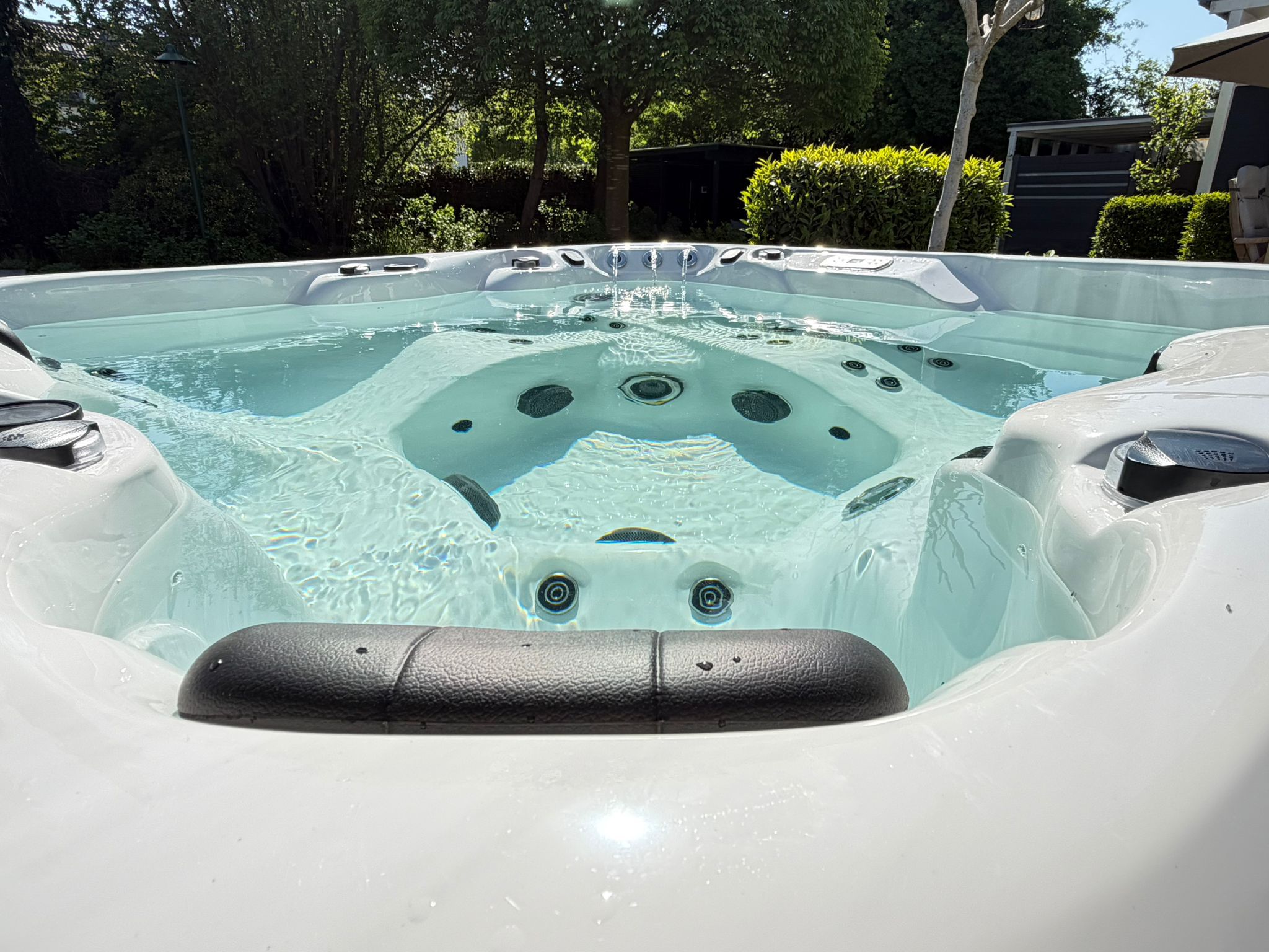 Earth Spas hot tub in a landscaped garden